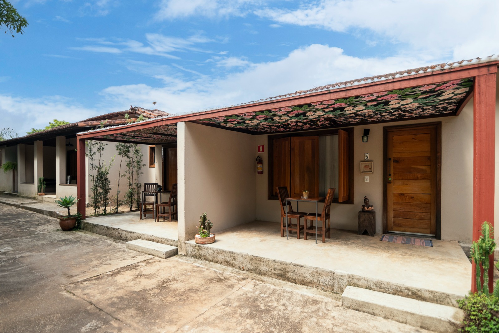 Suites facade with porches under a blue sky