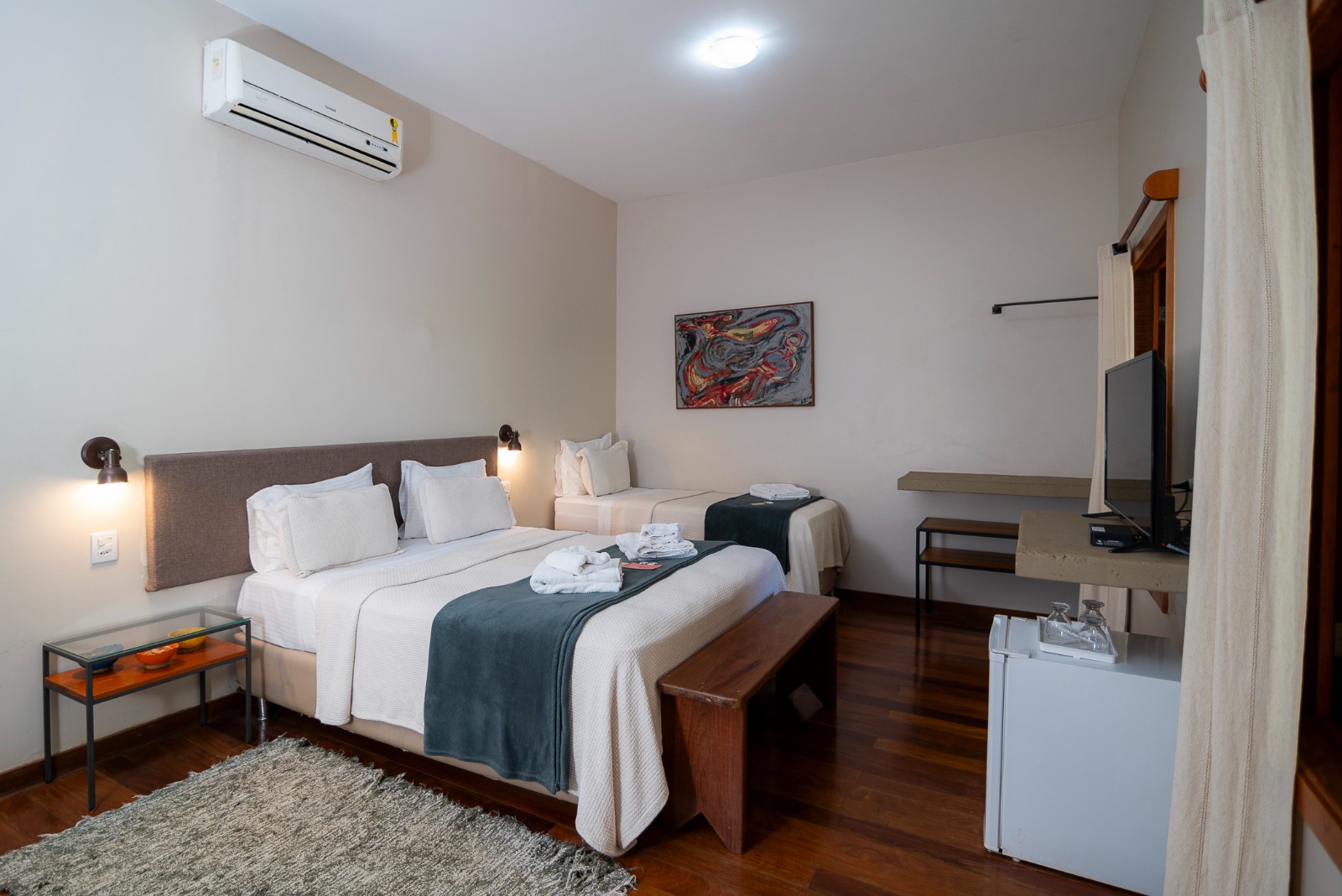 Triple suite with queen and single beds for up to three guests